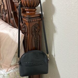 Selling this Valentino purse black with beige cloth inside .black leather
